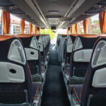 Our fleet - Interior of travel coach, view from rear end